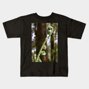 Unfurling tree fern. Kids T-Shirt